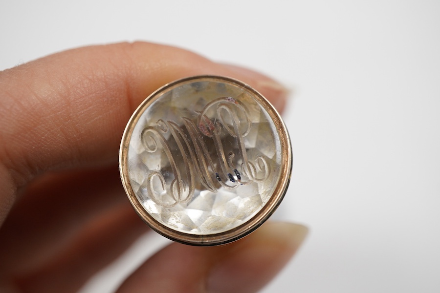 A late 19th century yellow metal and polychrome enamel desk seal, with rock crystal matrix, carved with a monogram, 69mm (small chip to the enamel), in original J.C Vickery fitted gilt tooled leather box.